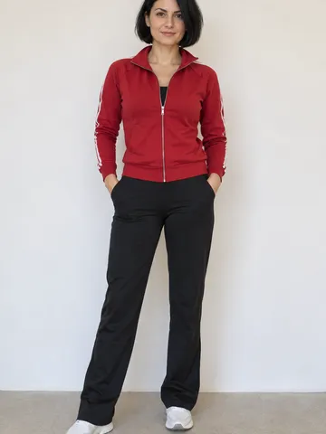 Original portrait of a woman with a short black bob in a red track jacket